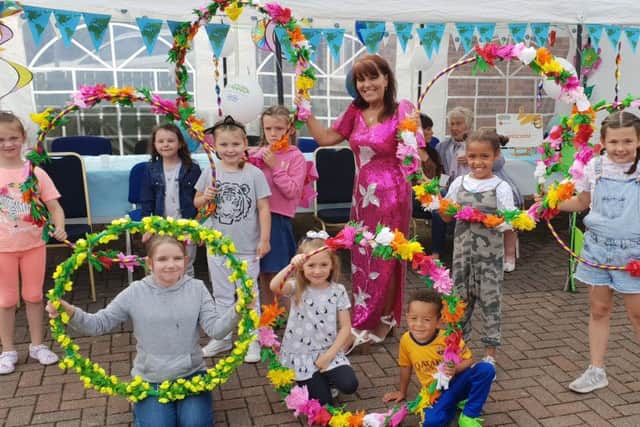 Margaret Cunningham pictured with local children at a previous community event in Hazelbank.