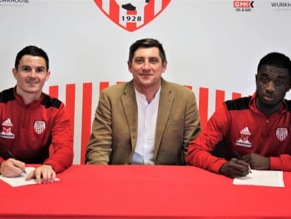 Declan Devine pictured with Ciaran Coll and Junior Ogedi-Uzokwe who both signed contract extensions with the club.