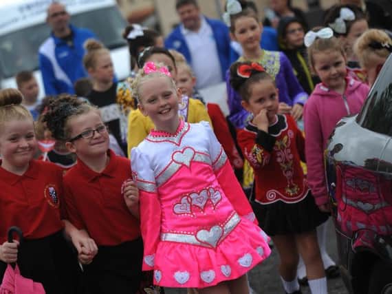 HOPE. Children from Creggan on parade in their Irish dancing costumes during the Creggan Festival.