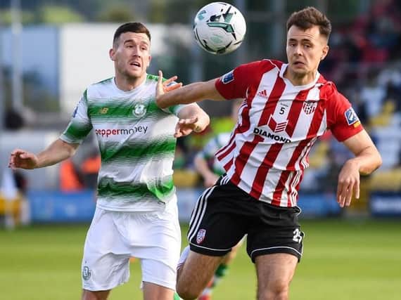 Defender Josh Kerr holds off Shamrock Rovers Aaron Greene, during his last game for Derry City, on Saturday.