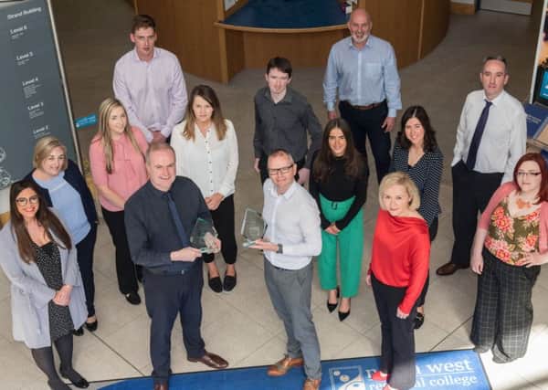 Conor McGurgan, Marketing and PR manager and Fergal Tuffy, Technology Innovation Manager, pictured with the Marketing and PR team and Business Support Centre team at North West Regional College, double award winners at the 2019 North West Business Awards. (Picture Martin McKeown).