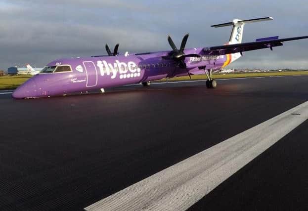The plane on the runway at Belfast International Airport.