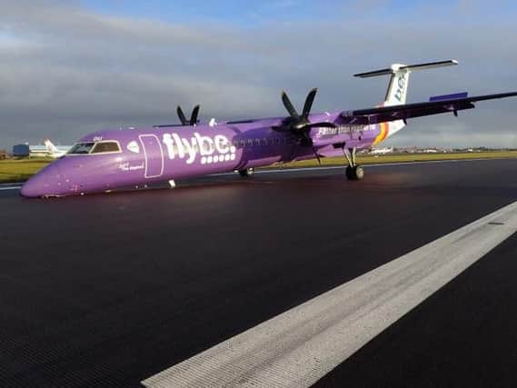 The plane on the runway at Belfast International Airport.