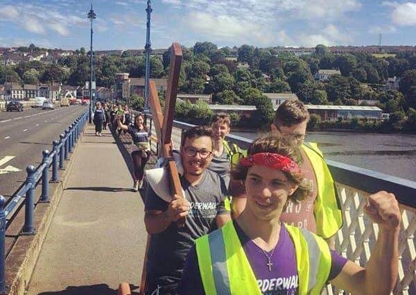 Previous participants arriving in Derry following the epic border walk from Rosstrevor.