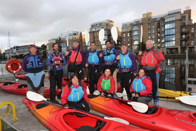 Leading international travel journalists enjoyed kayaking on the River Foyle as part of a fact-finding trip to Northern Ireland. They are pictured before heading out on the river with Far and Wild kayak instructors Shayne McClure (standing, left) and Darren Thompson (standing, second left).  
Pic by Lorcan Doherty