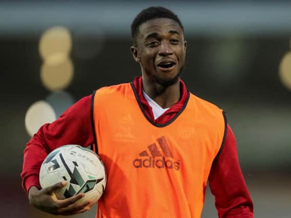 Derry City's Junior Ogedi-Uzokwe celebrates with the match ball, after scoring a hat-trick at Turner's Cross.