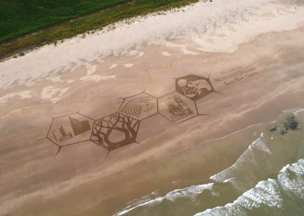 Downhill Strand -  a  giant sand sculpture created by a group of award-winning sand artists called Sand in Your Eyes  appeared on Downhill Beach on Wednesday
