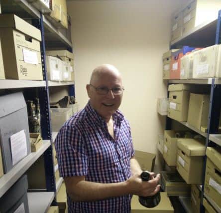 Dr Brian Lacey in the Museum Stores.