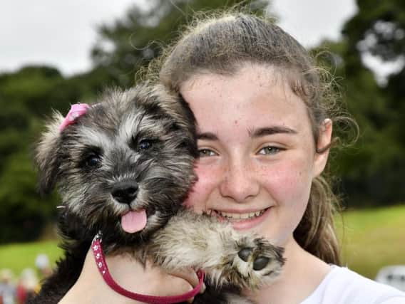 Holly Bradley pictured with her puppy Madge during a previous Pooches in the Park event. DER3018-102KM
