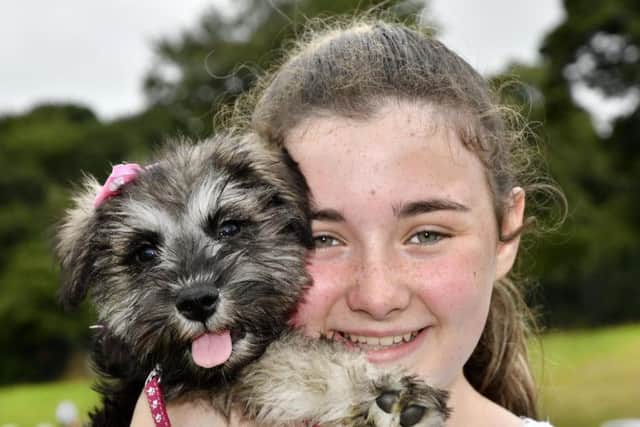 Holly Bradley pictured with her puppy Madge during  a previous Pooches in the Park event. DER3018-102KM