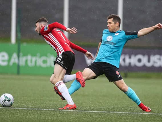 Derry City goalscorer, Jamie McDonagh skips away from the challenge of Sligo Rovers' Ronan Murray