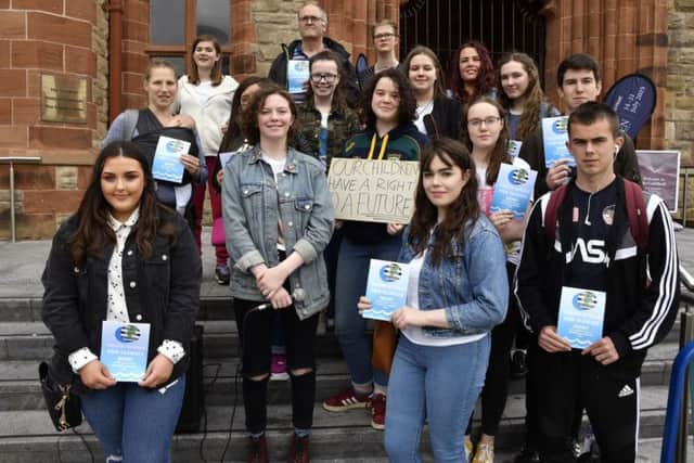Rois and Emma (second and third from left at front) with Members of the Youth Strike For Climate group who held a climate change rally in the Guildhall Square on Friday. DER3019-122KM