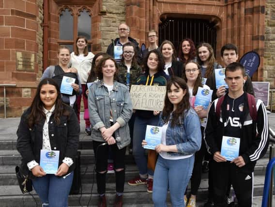 Rois and Emma (second and third from left at front) with Members of the Youth Strike For Climate group who held a climate change rally in the Guildhall Square on Friday. DER3019-122KM