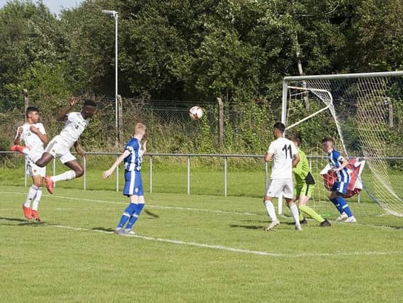 GOAL!. . . .Wolves centre back Filozofe Mabete climbs high to powerfully score from a corner against Coleraine in the O'Neills Foyle Cup u-14 game at Wilton Park, Derry on Tuesday night.