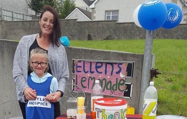 Little Ellen McIntyre with her mum Linda at the lemonade stand.