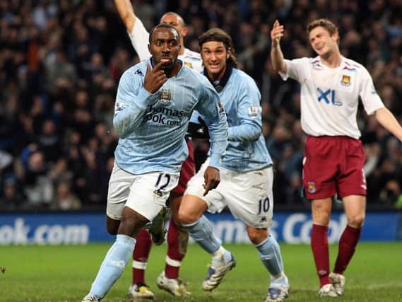 Ex-England striker, Darius Vassel celebrates scoring for Man City during his illustrious playing career.