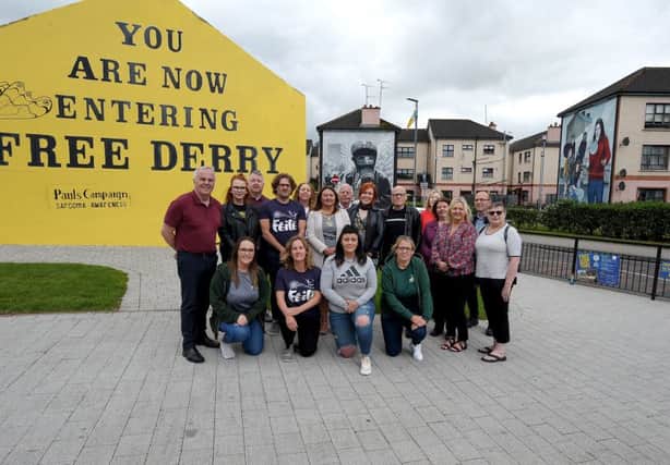 Group pictured at Free Derry Wall yesterday afternoon at the Gasyard Feiles programme of events commemorating the 50th anniversary of the Battle of the Bogside.  Included in the photograph are Raymond McCartney MLA, Paddy Danagher, Streets Alive co-ordinator, Mayor of Derry City and Strabane Colr Michaela Boyle , Colr Eamon McCann, Colr Patricia Logue  and Karen Mullen MLA. DER3119GS-02