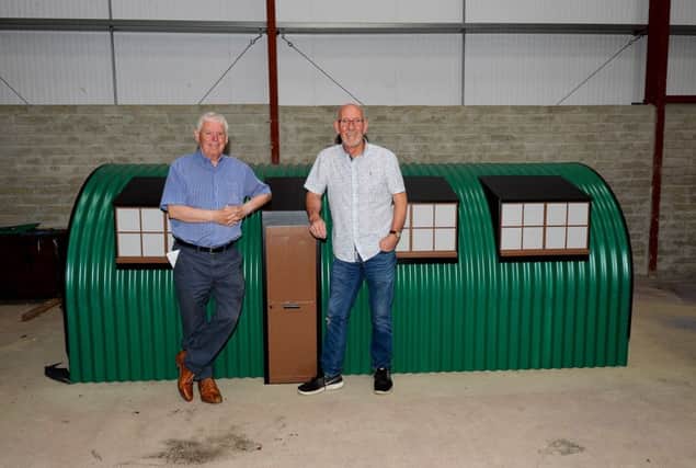 Willie Deery, on left, and Hugo McConnell pictured with the model of the Springtown Camp hut.  DER3019GS-032