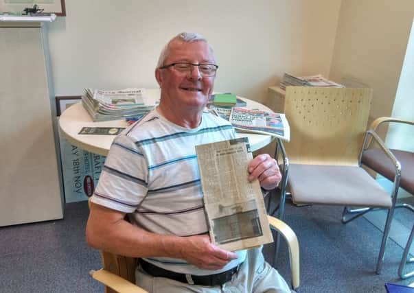 Tommy Mullan with the original article from the Derry Journal back in 1973 and inset, the house where his parents and 10 siblings aged 13 months to 21, lived at 6 Brandywell Avenue.