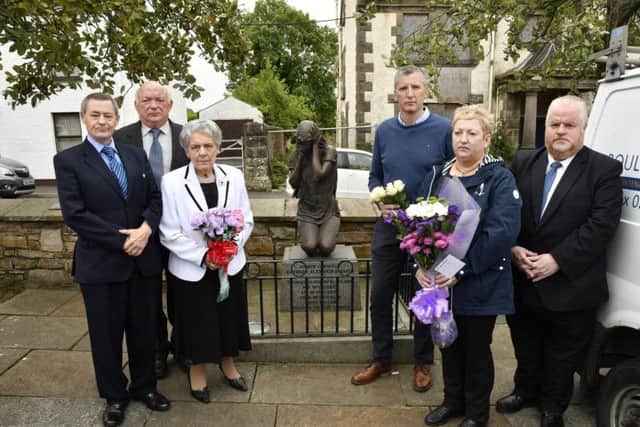 From left, William Jamieson, David Temple, Mary Hamilton, James Miller, Joyce Galbraith and Ernest McCay pictured at the Claudy memorial on Wednesday. DER3119-109KM
