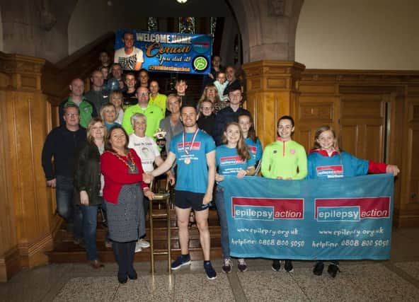 CONAN RUNS DOWN TO DERRY. . . .The Mayor of Derry City and Strabane District Council, Michaela Boyle welcomes marathon runner Conan McCready to the Guildhall on Friday night after his completion of 200 miles of marathon running over seven days and across three counties. Included in photo are family, friends and runners who helped him around the numerous marathons. (Photos: Jim McCafferty Photography)