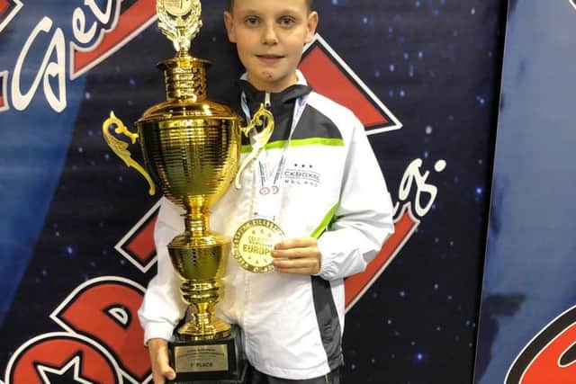 Kyle pictured with his trophy  after winning gold in Hungary.