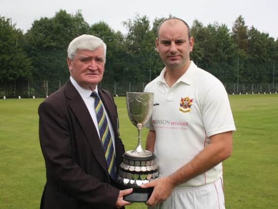 NWCU President, Connie McAllister, presents the Long's SuperValu Premier Division trophy to Brigade captain, Andy Britton.
