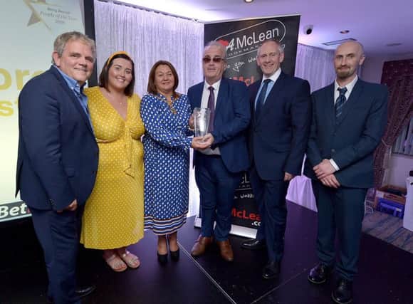 Richard Moore, Children In Crossfire, receives the Lifetime Achievement Award, from Mayor of Derry City and Strabane Colr. Michaela Boyle, at the Derry Journal People of the Year Awards held recently in the Waterfoot Hotel. Included in the photograph are Adrian Logan, compere, Niamh Moore, Paul McLean, managing director, BetMcLean, principle sponsor, and Brendan McDaid, Editor, Derry Journal. DER3619GS  081