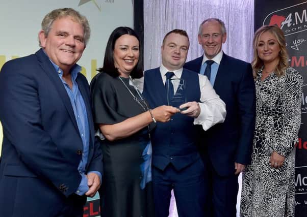 Pat Doran, Foyle Foodbank, receives the Community Development of the Year Award from Donna Mattison, APEX, award sponsor, at the Derry Journal People of the Year Awards held recently in the Waterfoot Hotel. Included in the photograph are Adrian Logan, compere, Paul McLean, managing director Bet McLean, principle sponsor and Louise Strain, Derry Journal. DER3619GS  066