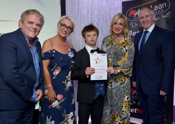 Benjamin Thompson receives a Special Recognition Certificate, in the Inspirational Young Person of the Year Award category, from Laurainne Mollison, City of Derry Airport, award sponsor, at the Derry Journal People of the Year Awards held recently in the Waterfoot Hotel. Included in the photograph are Adrian Logan, compere, Jacqui Diamond, Derry Journal and Paul McLean, managing director Bet McLean, principle sponsor. DER3619GS  072