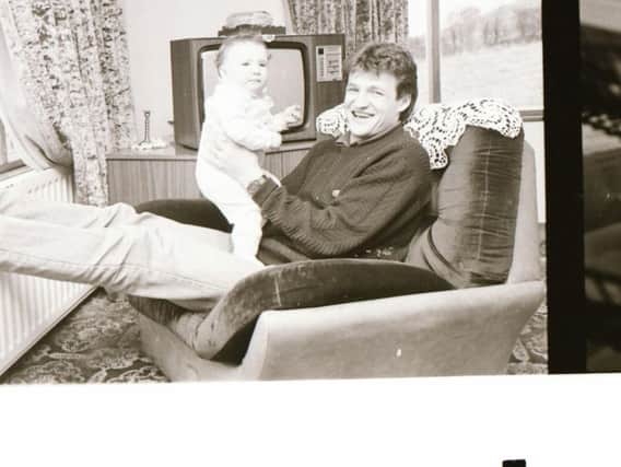 Alex Krstic relaxing with his baby son, Alexander at their home in Lisfannon in 1987.