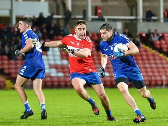 Steelstown's Ryan Devine and Claudy's Shane McGahon battle during the first meeting between the sides on Friday night before the Mitchels eventually won through in the replay.