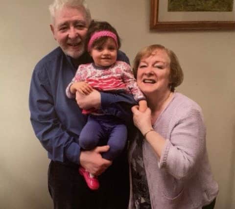 Eamon Friel pictured with his wife Caitlin and grand-daughter Milla