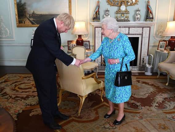 Boris Johnson with the Queen in Buckingham Palace on the day he officially became prime minister at the end of July.