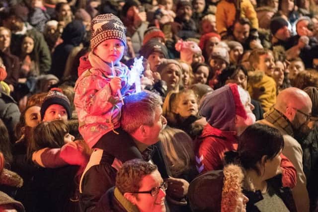 One young fan gets a pefect spot to watch the arrival of Santa during a previous Christmas Lights Switch on in Derry in Guildhall Square in 2017. Picture Martin McKeown. Inpresspics.com.