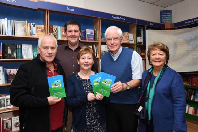 Fr Neal Carlin, second from right, pictured at the launch of his book 'Favourite Celitc Saints, A Simple Book of Prayers' in Veritas on Wednesday night with, from left, John Cooper, Paul Porter, Margaret Cooper and Marguerite Hamilton. DER3719-131KM