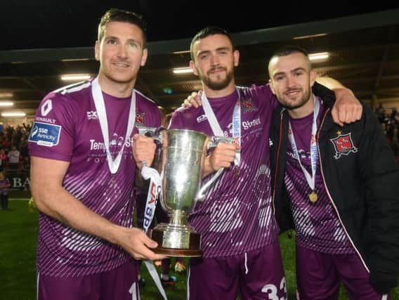 Dundalk trio Patrick McEleney, Dean Jarvis and Michael Duffy celebrate winning the EA Sports Cup and they could joint the list of Derry men to win a domestic treble.