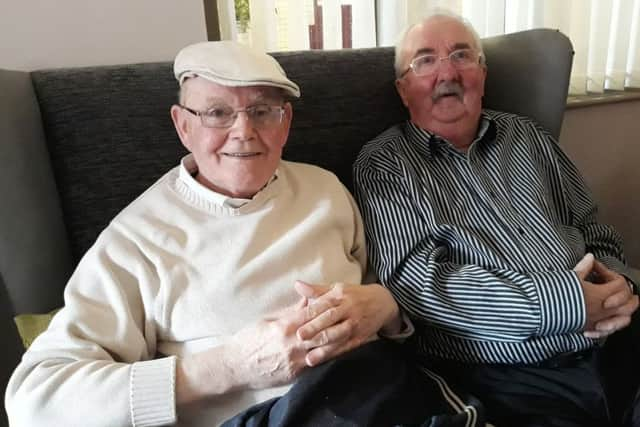 Residents of Glenbrook House smile for the camera at the 30th birthday celebrations.