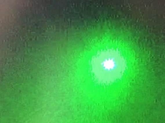 An image of the laser beam taken from the Eurocopter EC145 call sign 'Police 45'.