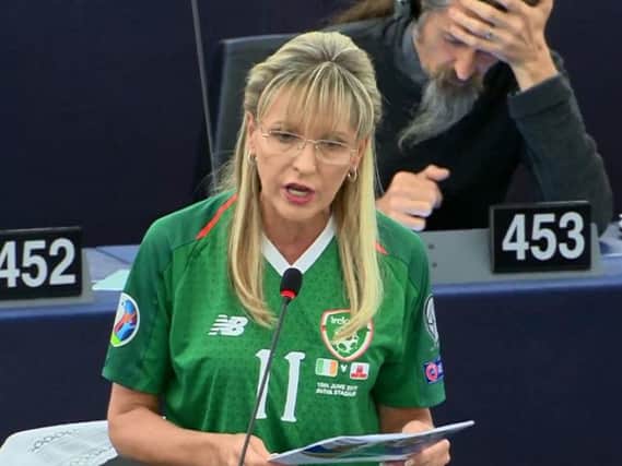Martina Anderson pictured wearing a jersey once worn by Derry man and Republic of Ireland international James McClean.