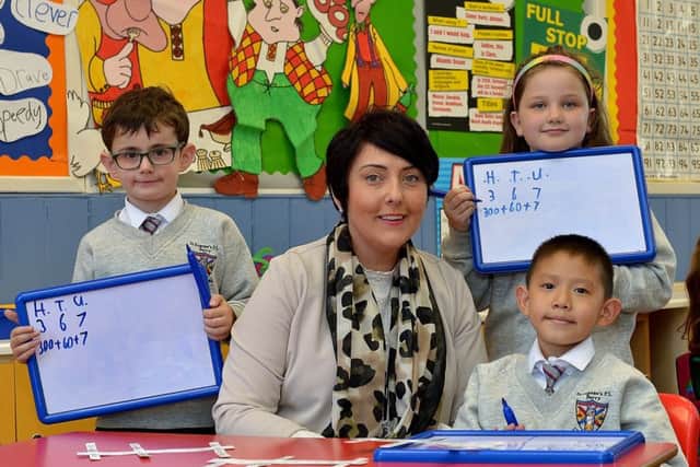 Recently appointed principal, Ms Therese Duggan, pictured with pupils at St Eugenes Primary School.  DER3819GS  052