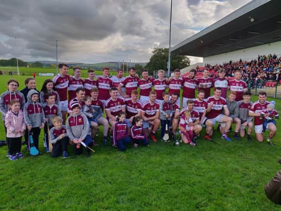 Banagher players and supporters celebrate their Derry Intermediate Hurling Championship victory at Owenbeg on Sunday.