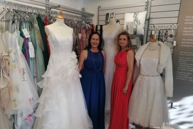 Paula Sweeney and Wendy Cunningham model some of the dresses.