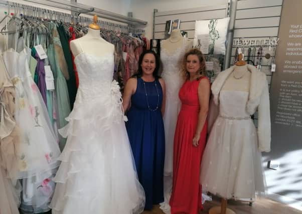 Paula Sweeney and Wendy Cunningham model some of the dresses.