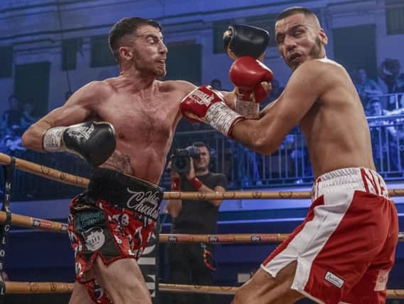 Tyrone McCullagh lands a left hook on his opponent Razaq Najib on his way to a one-sided victory in the quarter-finals of the Golden Contract featherweight event at York Hall last Friday night. Image courtesy of @MTKGlobal)