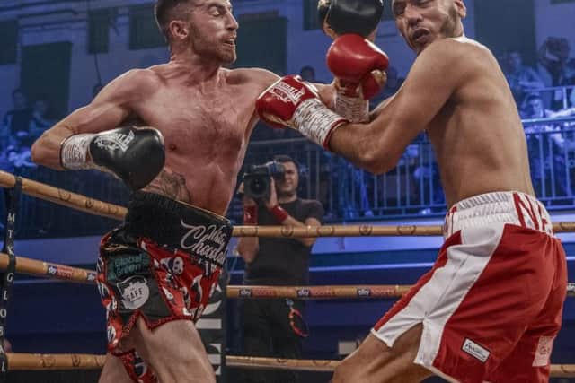 Tyrone McCullagh lands a left hook on his opponent Razaq Najib on his way to a one-sided victory in the quarter-finals of the Golden Contract featherweight event at York Hall last Friday night. Image courtesy of @MTKGlobal)