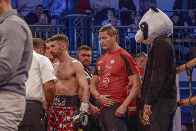 Tyrone McCullagh enters the ring at York Hall ahead of his quarter final bout as his good friend, Tyrone McKenna looks on wearing a giant panda suit. Image courtesy of @MTKGlobal)