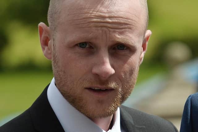 Loyalist blogger, Jamie Bryson, pictured at the funeral of Willie Frazer earlier this year. (Photo: Pacemaker)