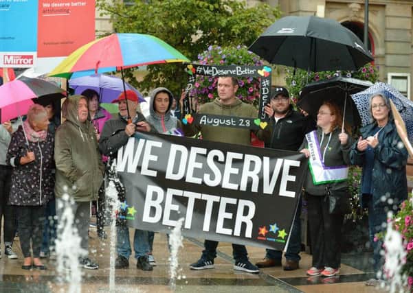 Demonstrators at a previous We Deserve Better protest, in Derrys Guildhall Square. DER3518GS013