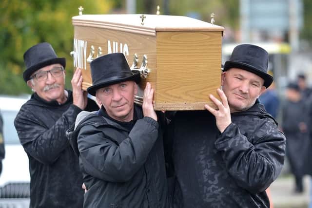 Protestors, dressed in funeral attire, carry a coffin at a rally organised by the group Action Against Cuts, at the Waterside Railway Station, on Saturday afternoon last. DER4019GS  023
